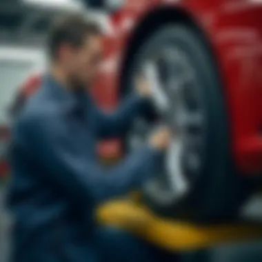 A mechanic examining a 17-inch hubcap for maintenance purposes